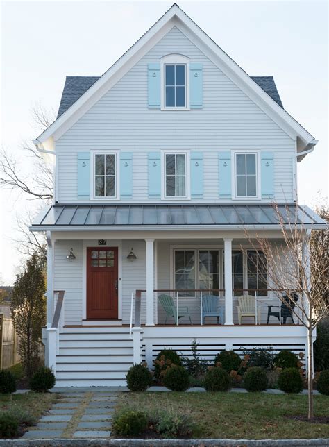 white house dark blue shutters.